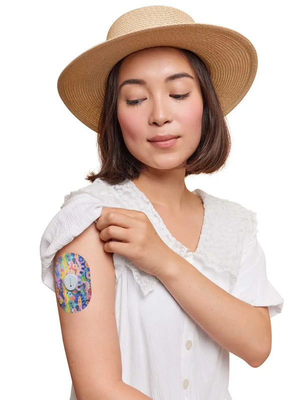 Person wearing colorful Dexcom G7 sensor patch on arm, emphasizing secure and stylish protection with Childhood Memories design.