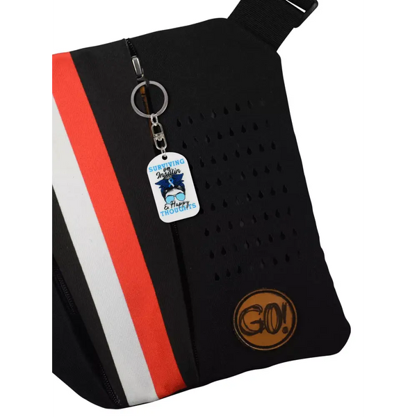 Medical Awareness Keychain - Surviving On Insulin design attached to a black and red bag.