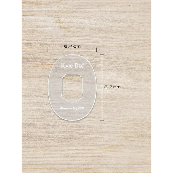 CGM sensor patch template on wooden surface with dimensions 6.4cm by 8.7cm, made from durable clear acrylic for precision cuts.