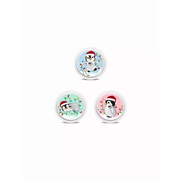 Three circular snow globes with cartoon penguins in Santa hats for Freestyle Libre stickers - Christmas