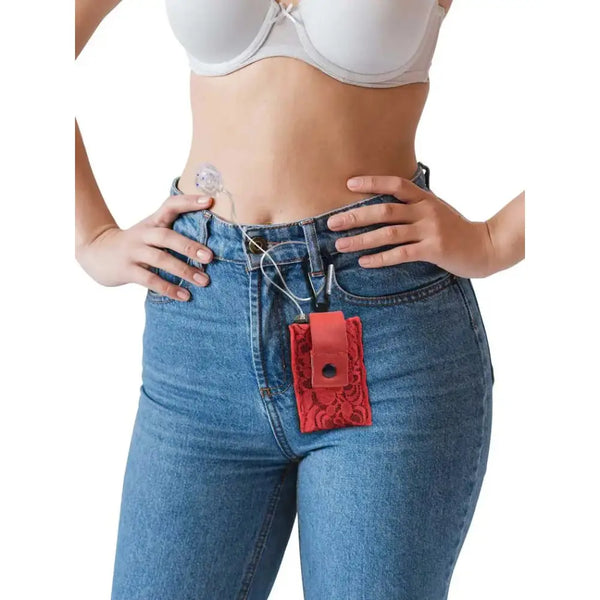 Lace insulin pump pouch clipped to jeans for discreet and stylish diabetes management.