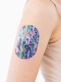 Dexcom G7 adhesive patch, Ethereal Bloom design, on the arm