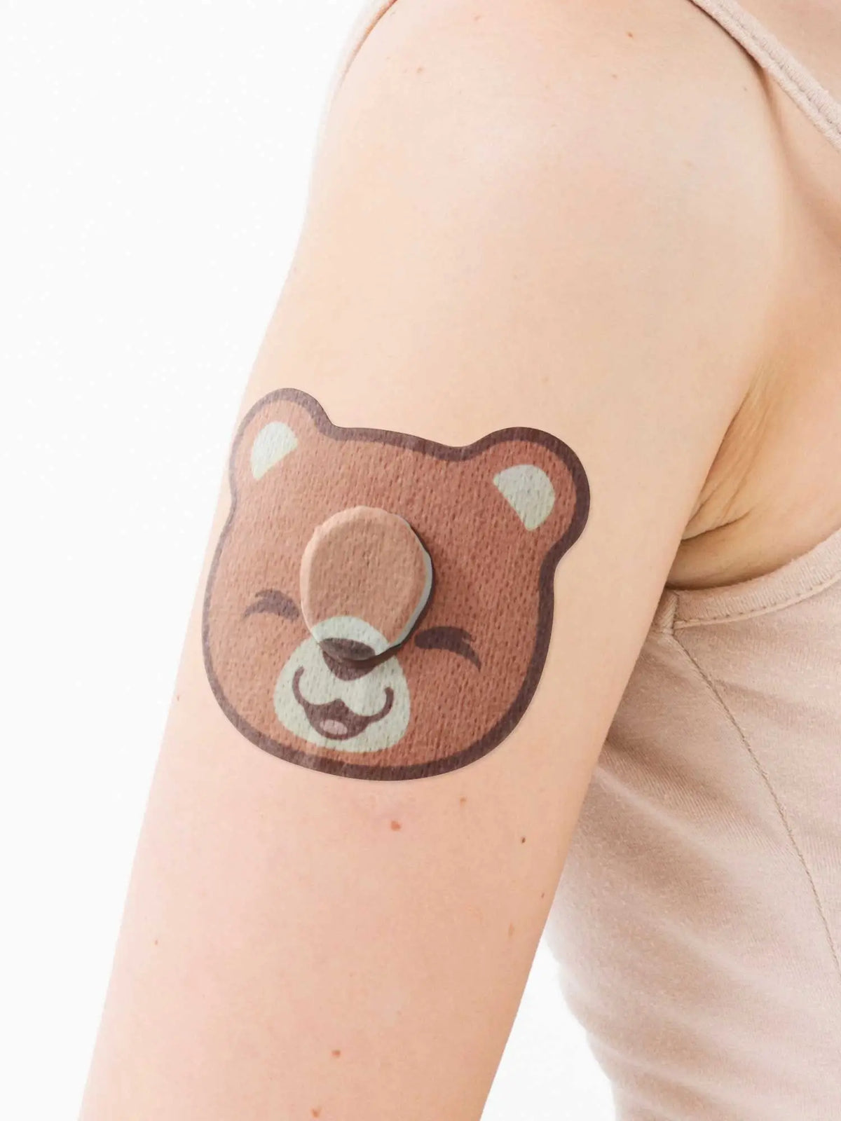 Dexcom G7 adhesive patch for kids, bear shape, on the arm