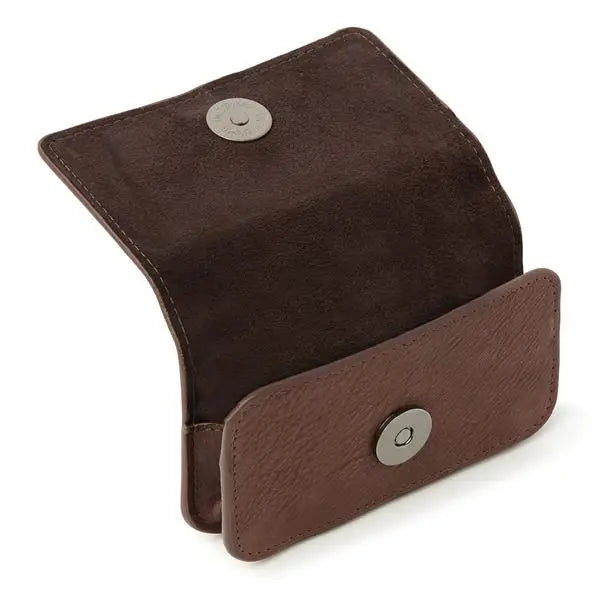 Leather insulin pump holder with lockable flap and magnetic closure for secure storage.