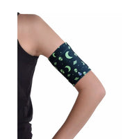 Blood glucose sensor armband for kids with fun moon and space pattern, fits securely and comfortably.