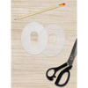 CGM sensor patch template with scissors and pencil for custom patch creation.