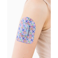 Omnipod pod adhesive patch, Spring Series, on the arm, close-up