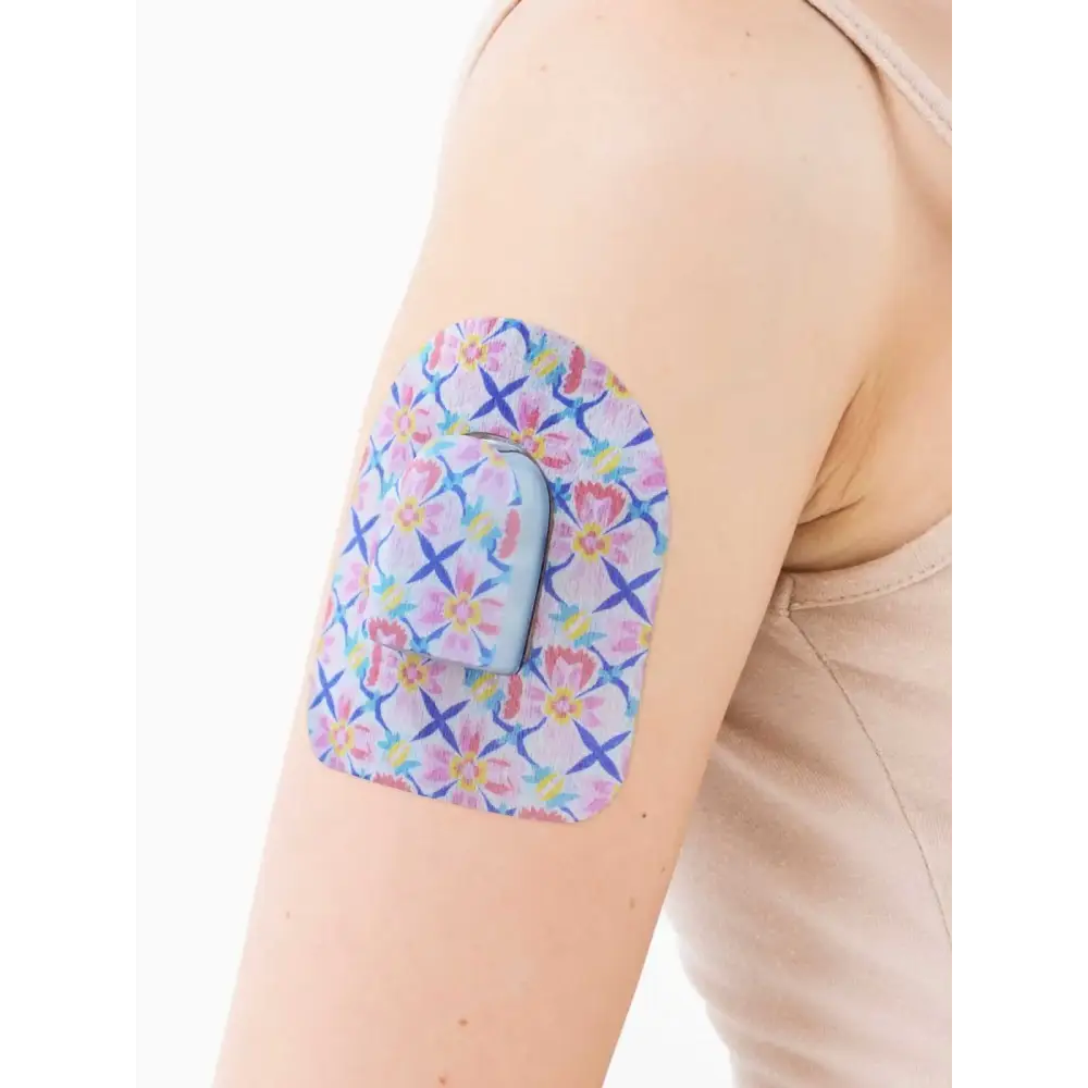 Omnipod pod adhesive patch, Spring Series, on the arm, close-up