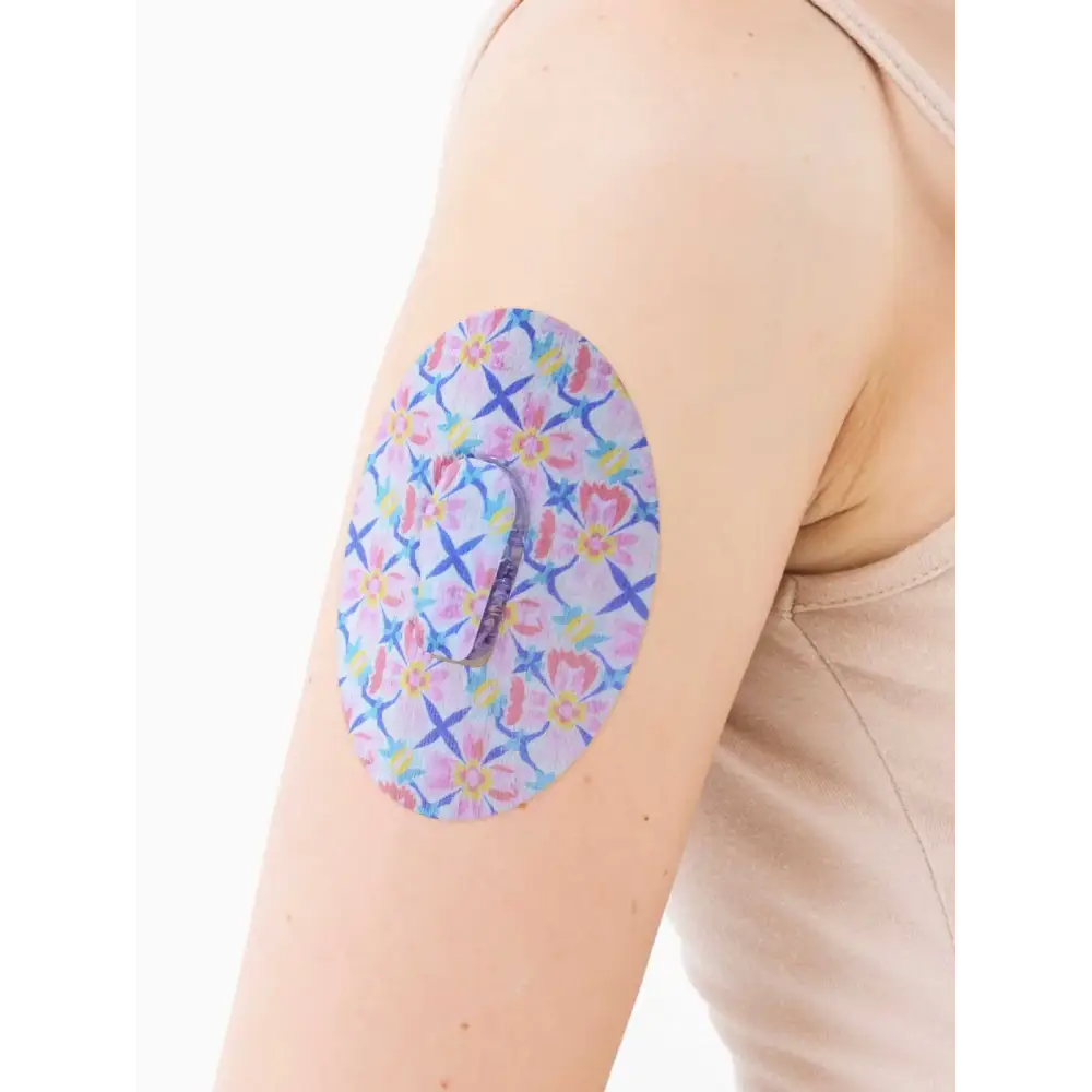 Dexcom G6 adhesive patch, Spring Series, on the arm, close-up