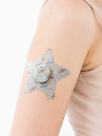 Dexcom G7 adhesive patch for kids, star shape, on the arm