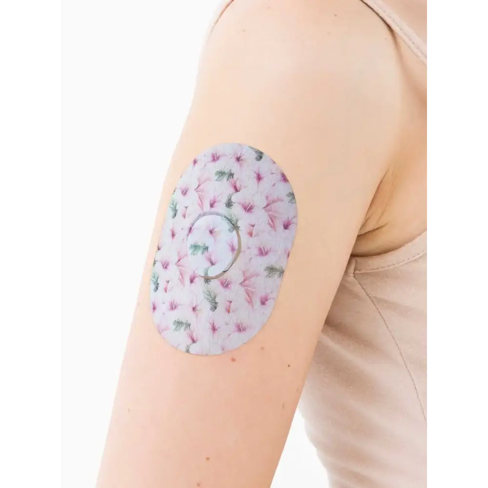 Dexcom G7 adhesive patch, Spring Series, on the arm, close-up