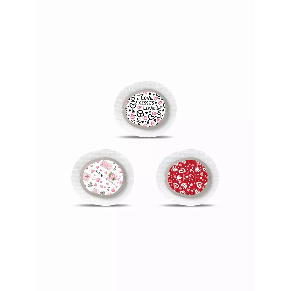 Three decorative round buttons with heart and floral patterns from Dexcom G7 Stickers Valentine Edition 2025
