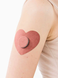 FreeStyle Libre 2 adhesive patch for kids, heart shape, on the arm