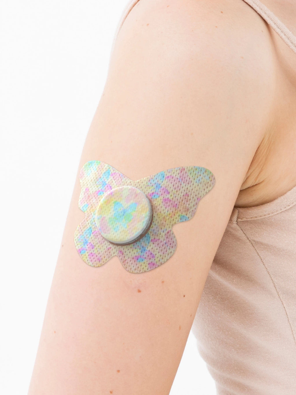 FreeStyle Libre 2 adhesive patch, butterfly shape, on the arm, close-up