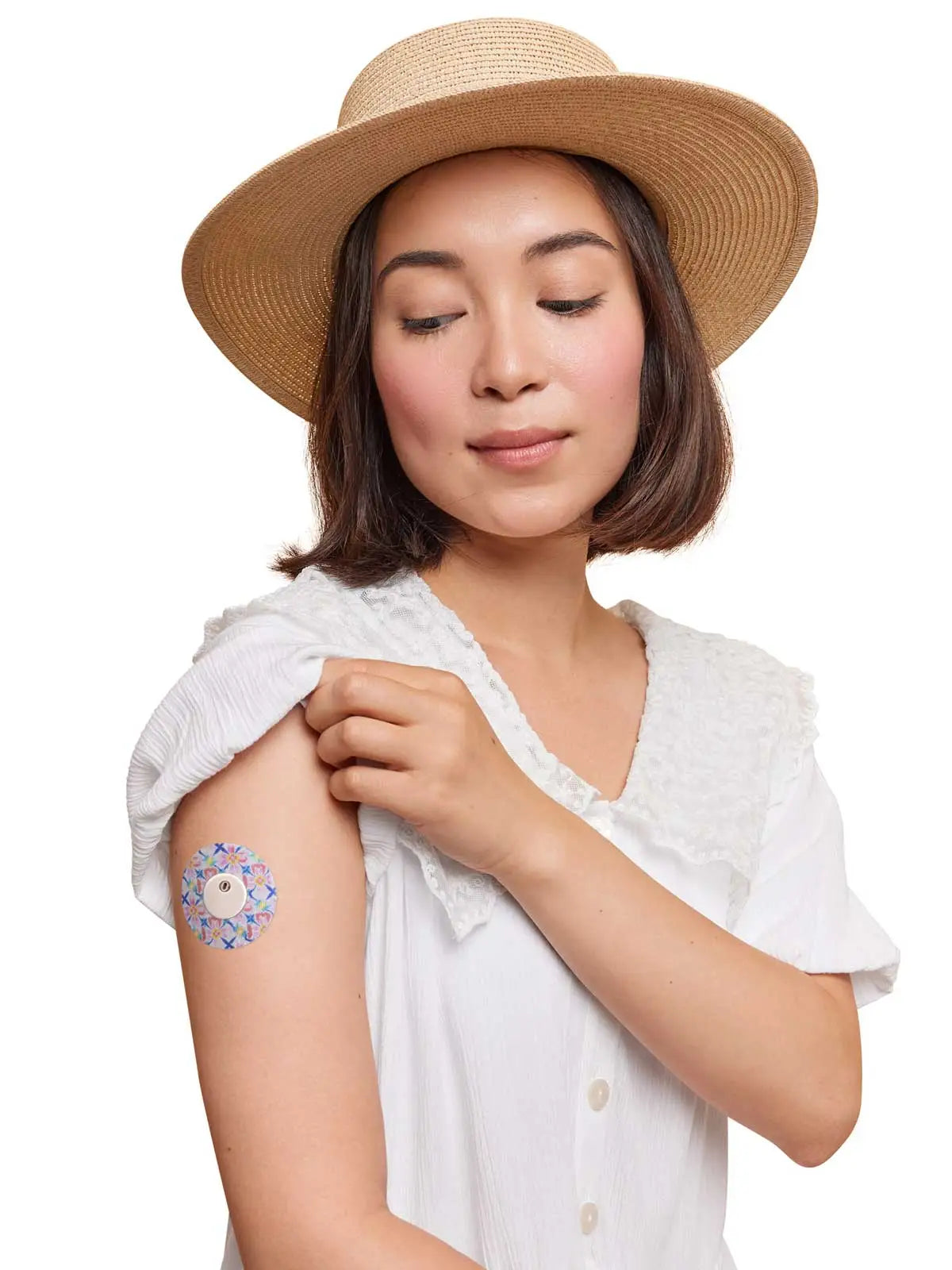 FreeStyle Libre 3 adhesive patch, Spring Series, worn on the arm by a woman