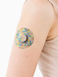 FreeStyle Libre 3 adhesive patch, Tequila Sunrise design, on the arm