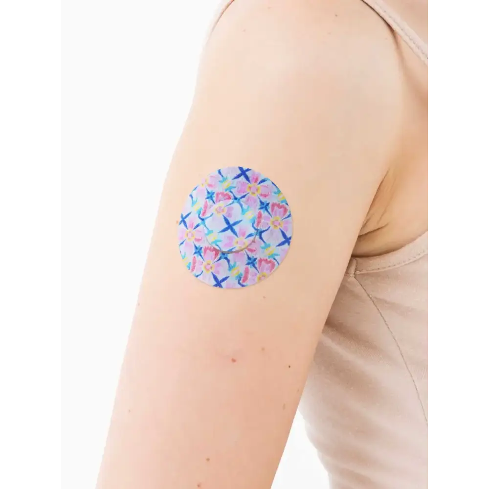 FreeStyle Libre 3 adhesive patch, Spring Series, on the arm, close-up