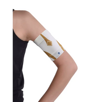 Glucose monitor and insulin pump armband worn on upper arm with white and gold design for secure diabetes device placement