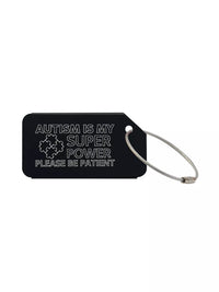 Black medical luggage tag with the text 'Autism Is My Super Power Please Be Patient' engraved.