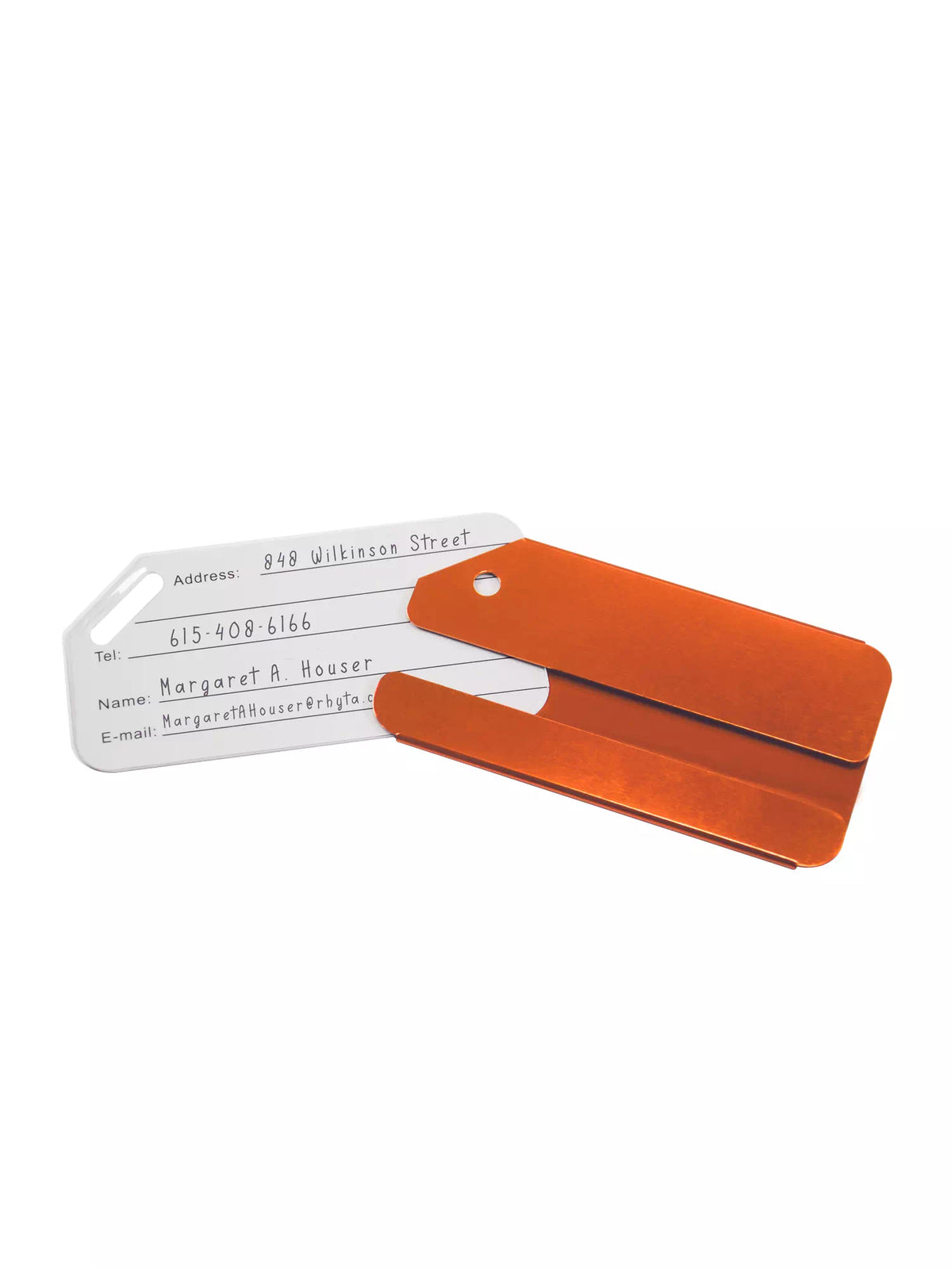 Orange medical luggage tag opened to reveal a name and address insert.
