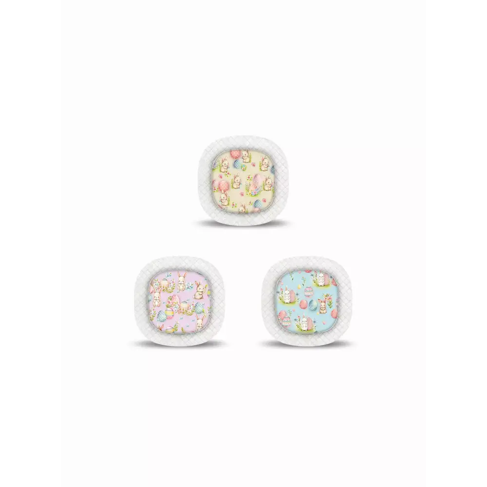 Three fluffy-edged cushions featuring Medtronic Simplera CGM Easter Edition 2025 patterns