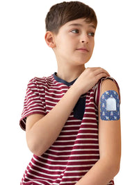 Omnipod pod adhesive patch, Astronaut design, worn by a boy