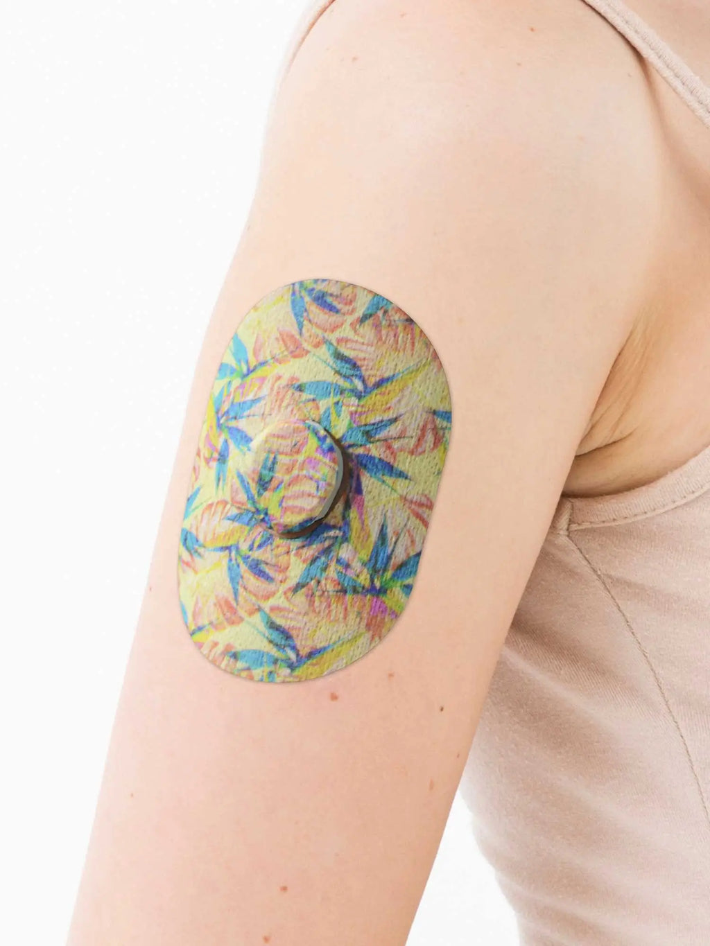 Dexcom G7 adhesive patch, Tequila Sunrise design, on the arm
