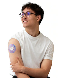 FreeStyle Libre 2 adhesive patch, Spring Series, worn on the arm by a man