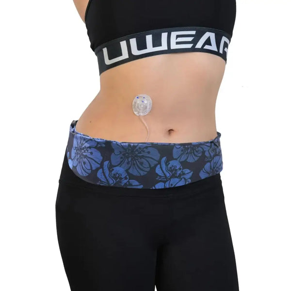 Adjustable insulin pump waist belt with blue floral design, providing discreet comfort and functionality.