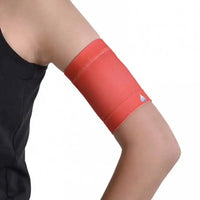 Protective armband for glucose sensors in red, designed for comfort and secure fit during activities.